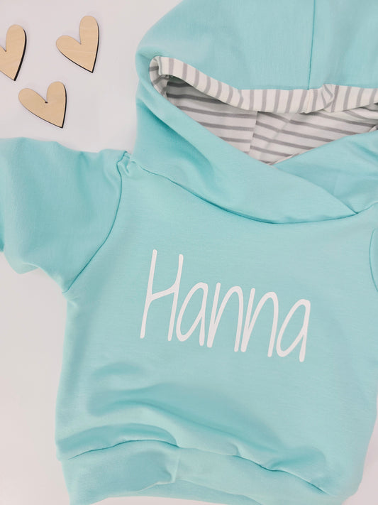 Individuell personalisierbarer Hoodie für Babys und Kinder in verschiedenen Farben erhältlich.